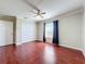 Spacious bedroom with hardwood floors and a ceiling fan at 8438 Diamond Cove Cir, Orlando, FL 32836