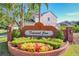 Attractive community sign, 'Diamond Cove', with colorful landscaping and brick facade at 8438 Diamond Cove Cir, Orlando, FL 32836