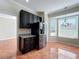 Bright dining area with bay window, chandelier, and stainless steel refrigerator at 8438 Diamond Cove Cir, Orlando, FL 32836