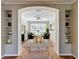 Dining room with an archway view, modern table and chairs, and decorative shelving niches at 8438 Diamond Cove Cir, Orlando, FL 32836