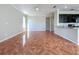 Open-concept living room with tile flooring and seamless flow into the kitchen area at 8438 Diamond Cove Cir, Orlando, FL 32836