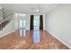 Bright living room boasting tile floors, large windows, and a staircase leading to the second floor at 8438 Diamond Cove Cir, Orlando, FL 32836