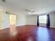 Spacious living room with hardwood floors and an open doorway at 8438 Diamond Cove Cir, Orlando, FL 32836