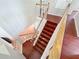 Hardwood staircase leading to the upper level with white railings at 8438 Diamond Cove Cir, Orlando, FL 32836