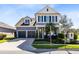 Charming two-story home with a well-manicured front yard and a welcoming entrance at 8803 Peachtree Park Ct, Windermere, FL 34786