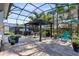 Spacious outdoor patio with a pergola, hot tub, grill and tiled flooring at 8803 Peachtree Park Ct, Windermere, FL 34786