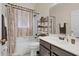 Bathroom with vanity, tub, and shower combination, and tile floors at 10286 Cypress Knee Cir, Orlando, FL 32825