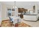 Cozy dining area featuring recessed lighting, neutral tile flooring, and a sunny window at 10286 Cypress Knee Cir, Orlando, FL 32825