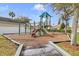 Community playground with a slide, climbing bars, and soft mulch for safe and active play at 10286 Cypress Knee Cir, Orlando, FL 32825