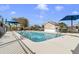 Community pool area features lounge chairs, umbrellas, and clear water for relaxing on hot summer days at 10286 Cypress Knee Cir, Orlando, FL 32825