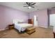 Spacious purple bedroom with modern furnishings and good natural light at 11619 Chateaubriand Ave, Orlando, FL 32836