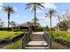 Stairway leading up to a community space surrounded by lush landscaping at 11619 Chateaubriand Ave, Orlando, FL 32836