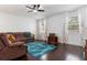 Cozy living room with plush seating and a decorative area rug at 11619 Chateaubriand Ave, Orlando, FL 32836