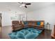 Spacious living area with a large sectional and bright, stylish decor at 11619 Chateaubriand Ave, Orlando, FL 32836