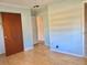 Bedroom featuring laminate flooring, closet, and neutral wall paint at 12314 Virginia Dr, Leesburg, FL 34788