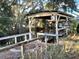 Scenic view of boat house with boat lift mechanism over calm waterway at 12314 Virginia Dr, Leesburg, FL 34788