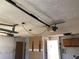 Garage with garage door opener and unfinished walls at 12314 Virginia Dr, Leesburg, FL 34788