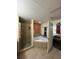 Spacious bathroom featuring a shower, jacuzzi tub, and doorway to bedroom at 12521 Floridays Resort Dr # 206F, Orlando, FL 32821