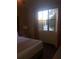 Bedroom view with a large window overlooking a serene lake with a fountain at 12521 Floridays Resort Dr # 206F, Orlando, FL 32821