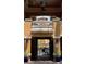 Exterior architectural details with a glimpse of the pool through a gated entrance at 12521 Floridays Resort Dr # 206F, Orlando, FL 32821