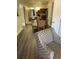 Interior view of living space with wood floors and modern furniture including dining set and lounge chair at 12521 Floridays Resort Dr # 206F, Orlando, FL 32821