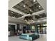 A community lobby features modern decor and a front desk reception area at 12521 Floridays Resort Dr # 206F, Orlando, FL 32821
