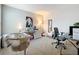 Bedroom featuring a desk setup, crib, and artistic decorations at 13730 Bravante Aly, Windermere, FL 34786