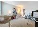 Bedroom featuring a desk setup, crib, and artistic decorations at 13730 Bravante Aly, Windermere, FL 34786