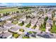 This aerial view shows a residential neighborhood with neatly lined homes, manicured lawns, and community landscaping at 15506 Tidal Cove Aly, Winter Garden, FL 34787