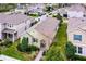 Aerial view showing the landscaped property with well-kept lawns and brick-paved walkway, set in a neighborhood at 15506 Tidal Cove Aly, Winter Garden, FL 34787