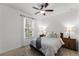 Cozy bedroom with a ceiling fan, two nightstands, and a comfortable bed at 15506 Tidal Cove Aly, Winter Garden, FL 34787