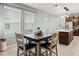 Dining area with views to kitchen, with an open concept feel and natural light at 15506 Tidal Cove Aly, Winter Garden, FL 34787