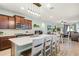 Spacious kitchen featuring a large island with quartz countertops and modern pendant lighting at 15506 Tidal Cove Aly, Winter Garden, FL 34787