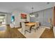 Dining room with decorative gray wall and view to outdoor space at 16259 Misty Hills Ave, Winter Garden, FL 34787