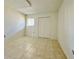 Neutral bedroom featuring tile floor, one window, and bi-fold door closet at 166 Scottsdale Sq # 166, Winter Park, FL 32792