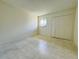 Clean bedroom with neutral paint and tile flooring at 166 Scottsdale Sq # 166, Winter Park, FL 32792