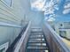 Exterior stairs leading to apartments on a bright sunny day at 166 Scottsdale Sq # 166, Winter Park, FL 32792