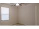 Comfortable bedroom featuring a ceiling fan and a sunlit window at 1740 Deans Crossing Ln, Orlando, FL 32825