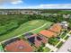 Beautiful community featuring lush green spaces, well-maintained homes, and a serene lake at 2281 The Oaks Blvd, Kissimmee, FL 34746