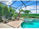 Inviting pool area with comfortable seating and a relaxing spa at 2281 The Oaks Blvd, Kissimmee, FL 34746