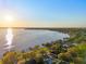 Breathtaking aerial view of the sunset over the water near residential neighborhood at 2294 Lakeview Ave, Clermont, FL 34711