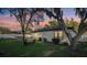 Backyard view of a single-Gathering home featuring a fence, outdoor seating, and above-ground pool at 2294 Lakeview Ave, Clermont, FL 34711