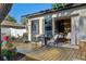 Relaxing backyard space featuring a wood deck and sliding glass doors to the home's interior at 2294 Lakeview Ave, Clermont, FL 34711