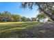 Expansive waterfront lot with mature trees overlooking a serene lake providing picturesque scenery at 2294 Lakeview Ave, Clermont, FL 34711