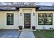 View of the front door entrance with decorative planters on either side at 2294 Lakeview Ave, Clermont, FL 34711