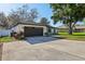 Charming single-story home featuring a well-maintained lawn, a two-car garage, and a modern front door at 2294 Lakeview Ave, Clermont, FL 34711