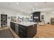 Open kitchen showcasing a large island that connects to a living room area and sleek appliances at 2294 Lakeview Ave, Clermont, FL 34711