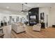 Comfortable living room with a modern fireplace, television, recessed lighting, and wood-look flooring at 2294 Lakeview Ave, Clermont, FL 34711