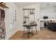 Home office with sleek desk, modern shelving, neutral colors and decor, and wood look flooring at 2294 Lakeview Ave, Clermont, FL 34711