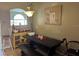 Inviting dining room featuring a dark wood table, bench, and a complementary accent cabinet at 231 Cranbrook Dr, Kissimmee, FL 34758